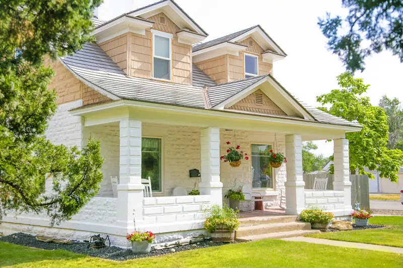 Craftsman-style house with a deep front porch and square columns